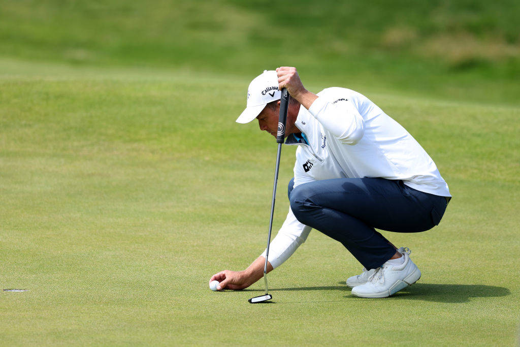 Henrik Stenson lines up a putt